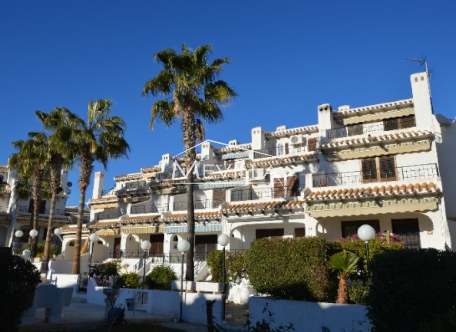 Big townhouse with small garden only 70 m from Cala Capitán beach. 